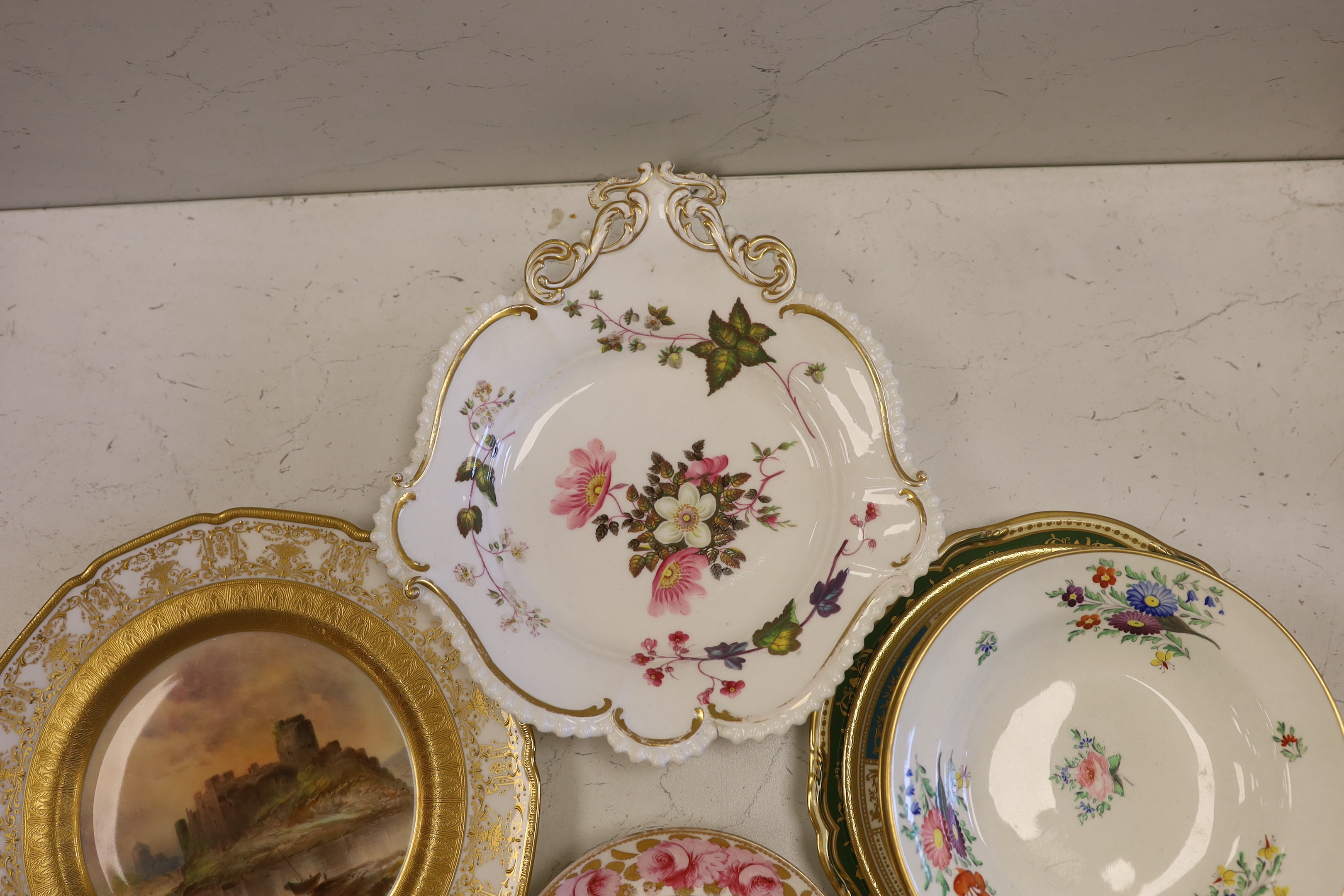 A collection of 19th/20th century English porcelain tableware including a Royal Doulton ‘Pembroke Castle’ cabinet plate, 26cm diameter (11)